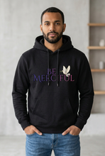 Load image into Gallery viewer, Individual model in the uppercase Be Merciful hoodie
